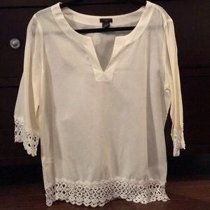 A white Ann Taylor blouse with a cute long v-neck.